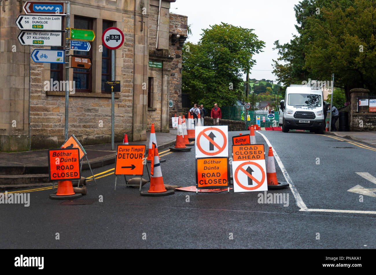 Road closed detour signs signage in Irish language Gaelic at Donegal Town, County Donegal, Ireland Stock Photo