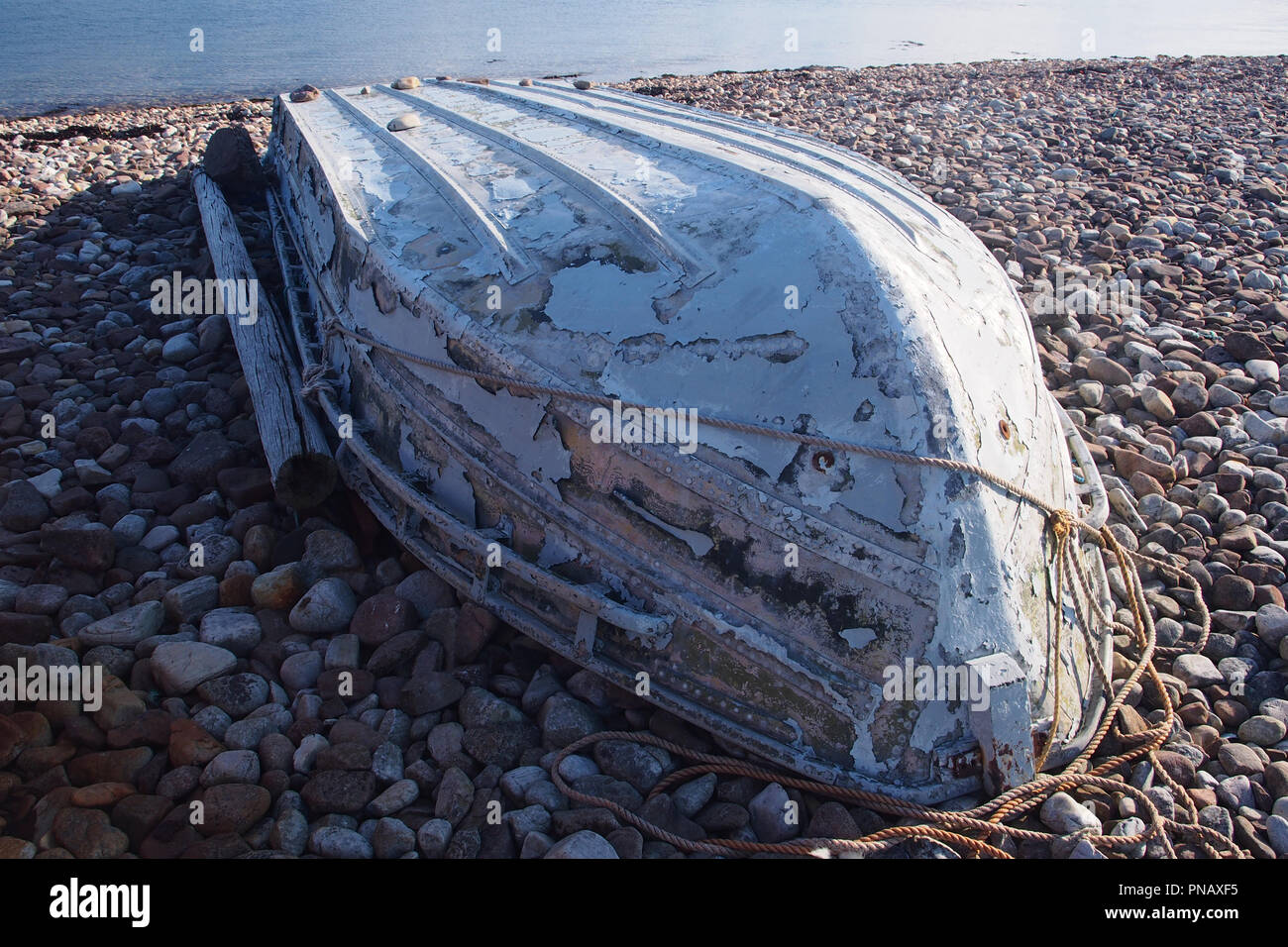 Old upturned boat on coast hi-res stock photography and images - Alamy