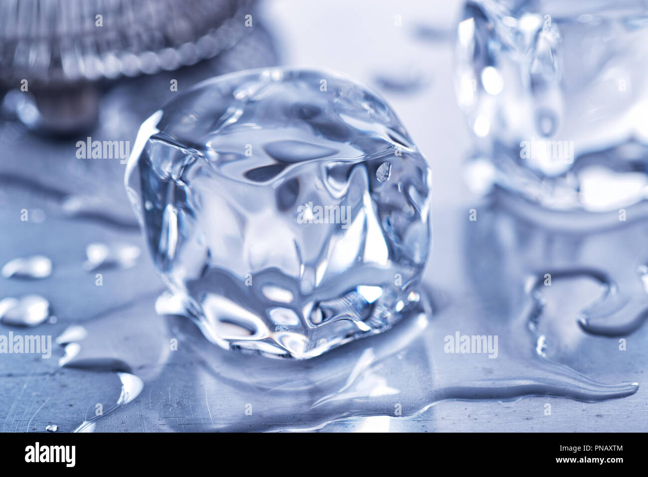 Two Ice Cubes Melting On A Steel Bar Top Stock Photo 219672788