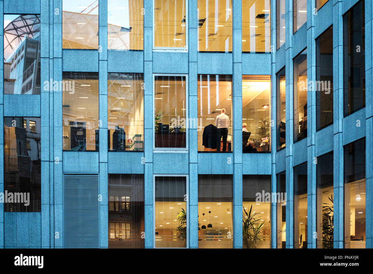 UK,City of London-Woirking late.Corporate office at the evening. Stock Photo