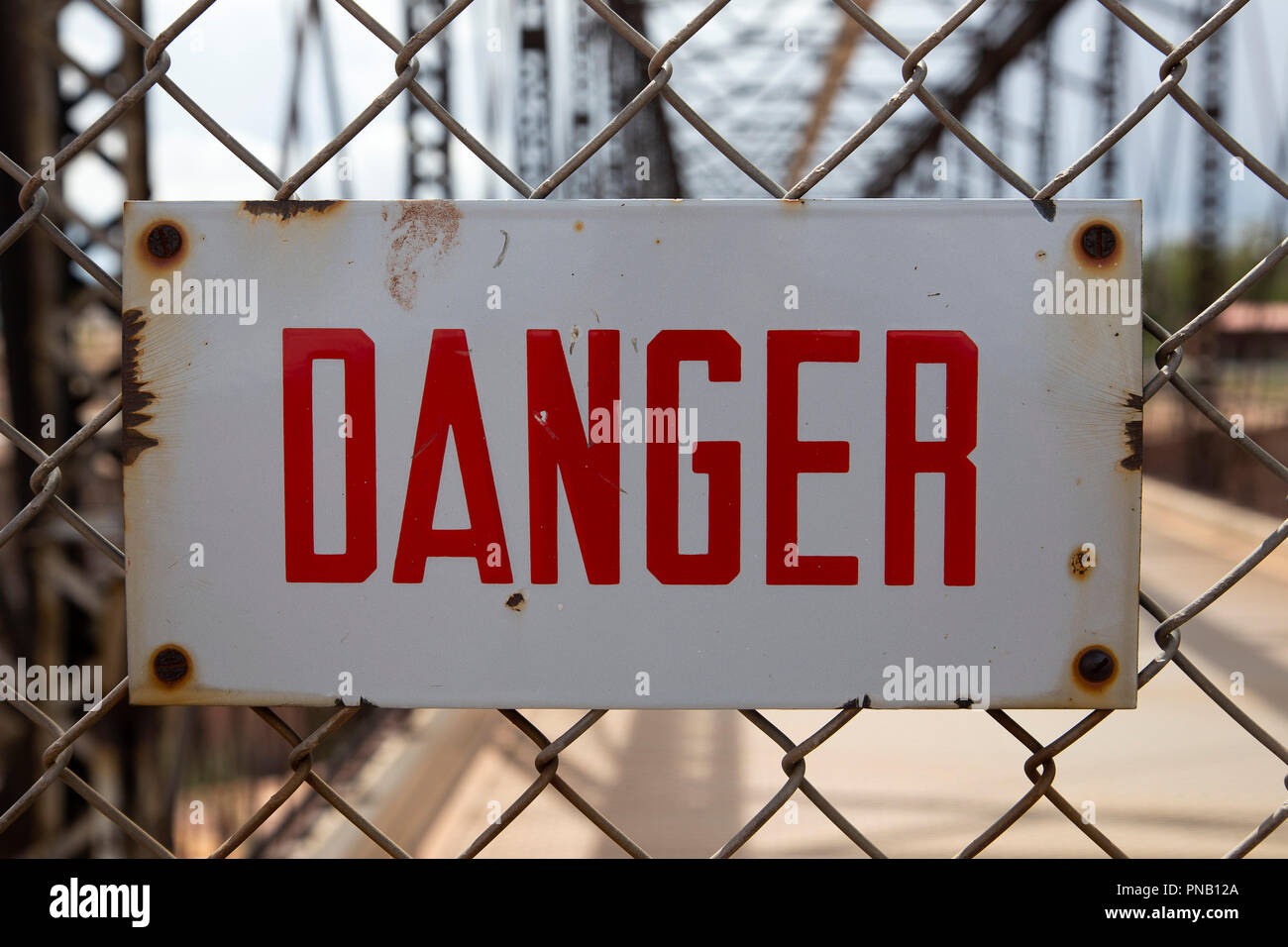 Vintage Enamel No Trespassing and Danger Signs Stock Photo