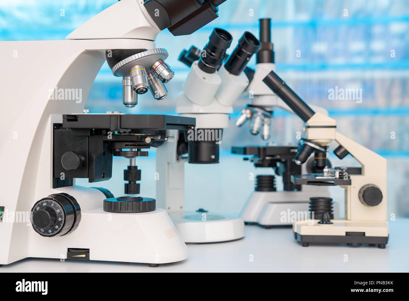 Four microscopes of different designs in the laboratory Stock Photo Alamy