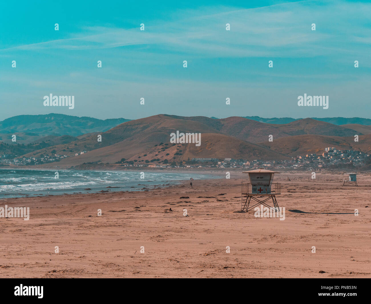 Lone lifeguard cabin standing on the beach on a windy summers day Stock Photo