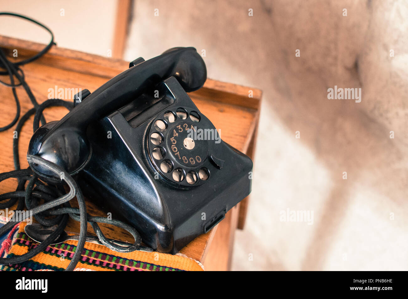 Old fashioned black telephone in retro/vintage style from long gone era Stock Photo