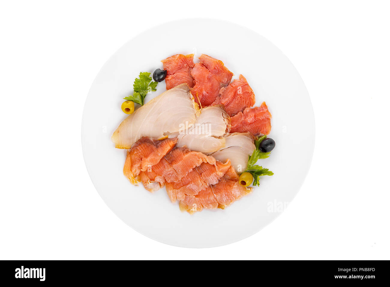 Cold appetizer before alcohol, assorted fish, salmon fillet, lightly salted, chum, smoked with wasabi sauce, mayonnaise, sour cream, olives, parsley o Stock Photo