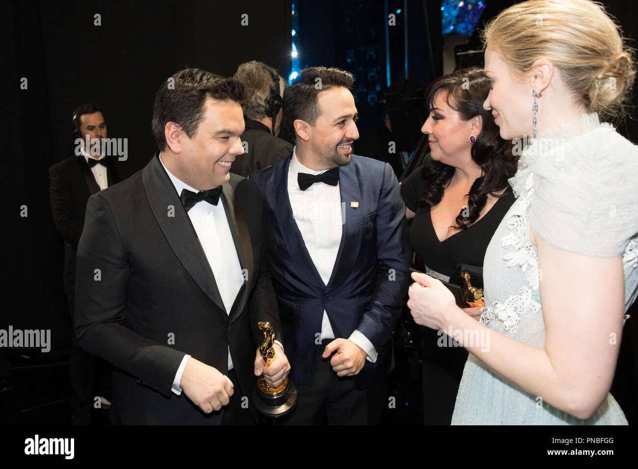 After winning the Oscar® for music written for motion pictures (original song) for “Remember Me” from “Coco”, Kristen Anderson-Lopez and Robert Lopez chat backstage with Lin-Manuel Miranda and Emily Blunt during the live ABC Telecast of The 90th Oscars® at the Dolby® Theatre in Hollywood, CA on Sunday, March 4, 2018.  File Reference # 33546 774PLX  For Editorial Use Only -  All Rights Reserved Stock Photo