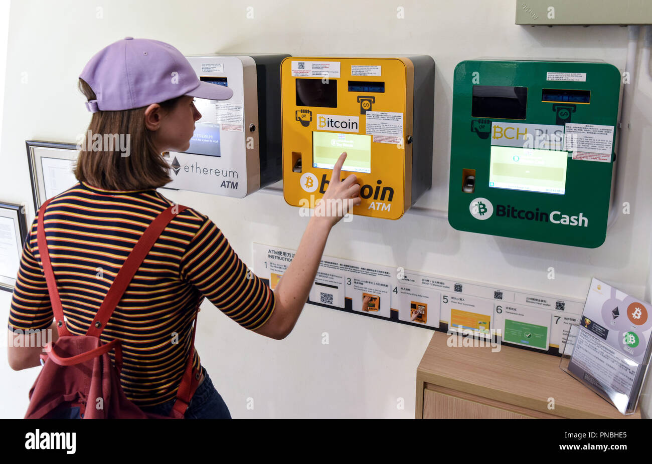 HONG KONG,HONG KONG SAR,CHINA: SEPTEMBER 20th, 2018.A woman uses the  Bitcoin and Ethereum ATM installed at the Genesis Block Wan Chai. Genesis  Block i Stock Photo - Alamy