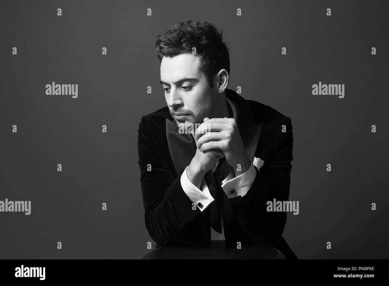 Close up portrait of a young handsome man in a dinner jacket, bow tie