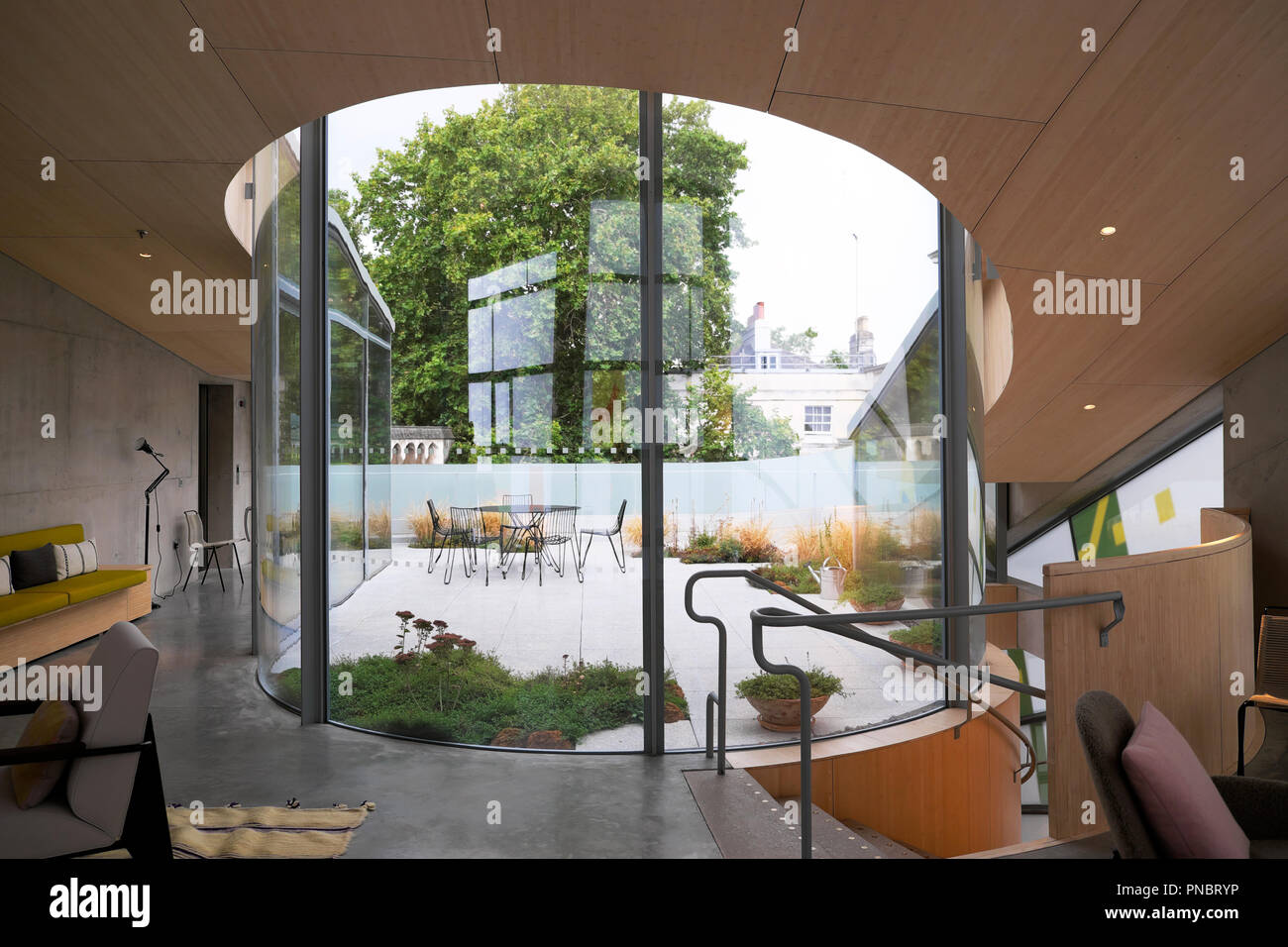 View looking out onto the rooftop roof top garden from inside Maggies Centre at St Barts Hospital in Smithfield City of London UK KATHY DEWITT Stock Photo