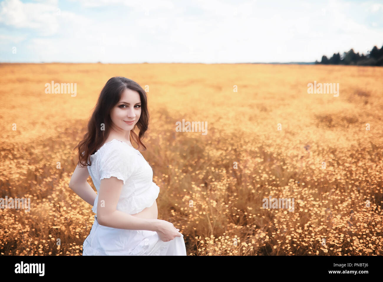 Pregnant woman in nature for a walk in the autumn Stock Photo - Alamy