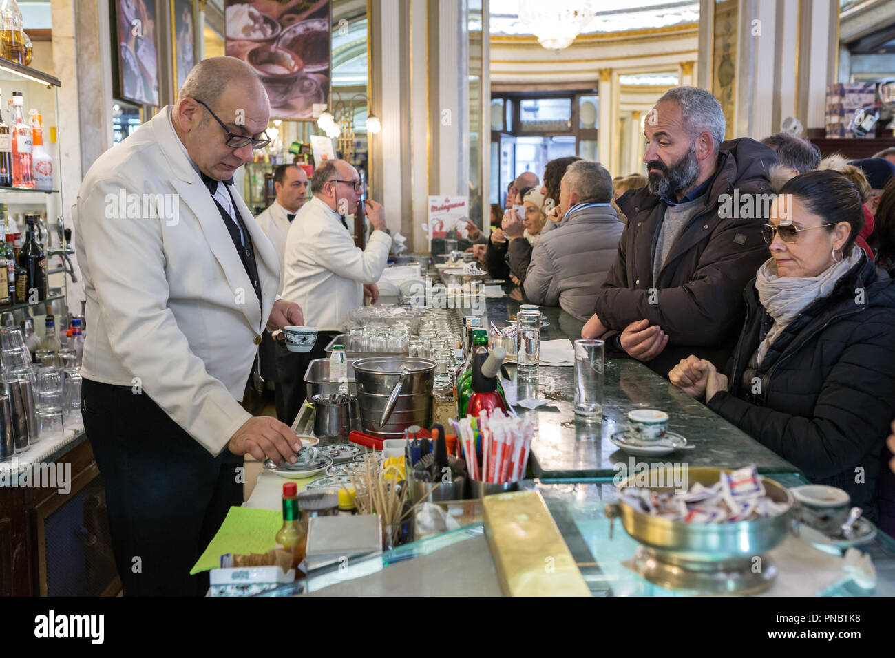 Naples, Italy - December 3, 2017: Unidentified people visiting famous italian cafe Gambrinus. It is a historical coffee shop in Naples Stock Photo