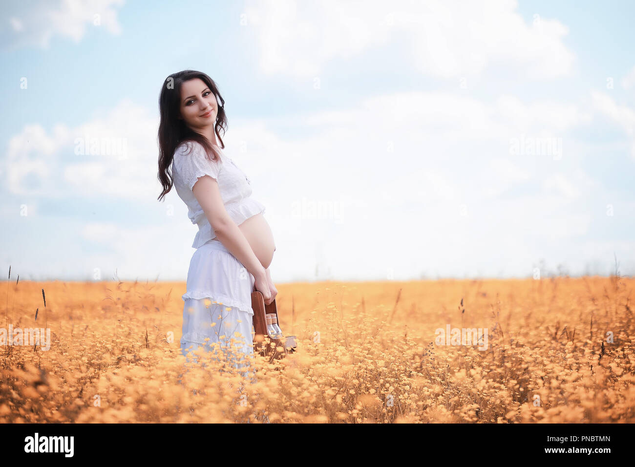 Pregnant woman in nature for a walk in the autumn Stock Photo - Alamy