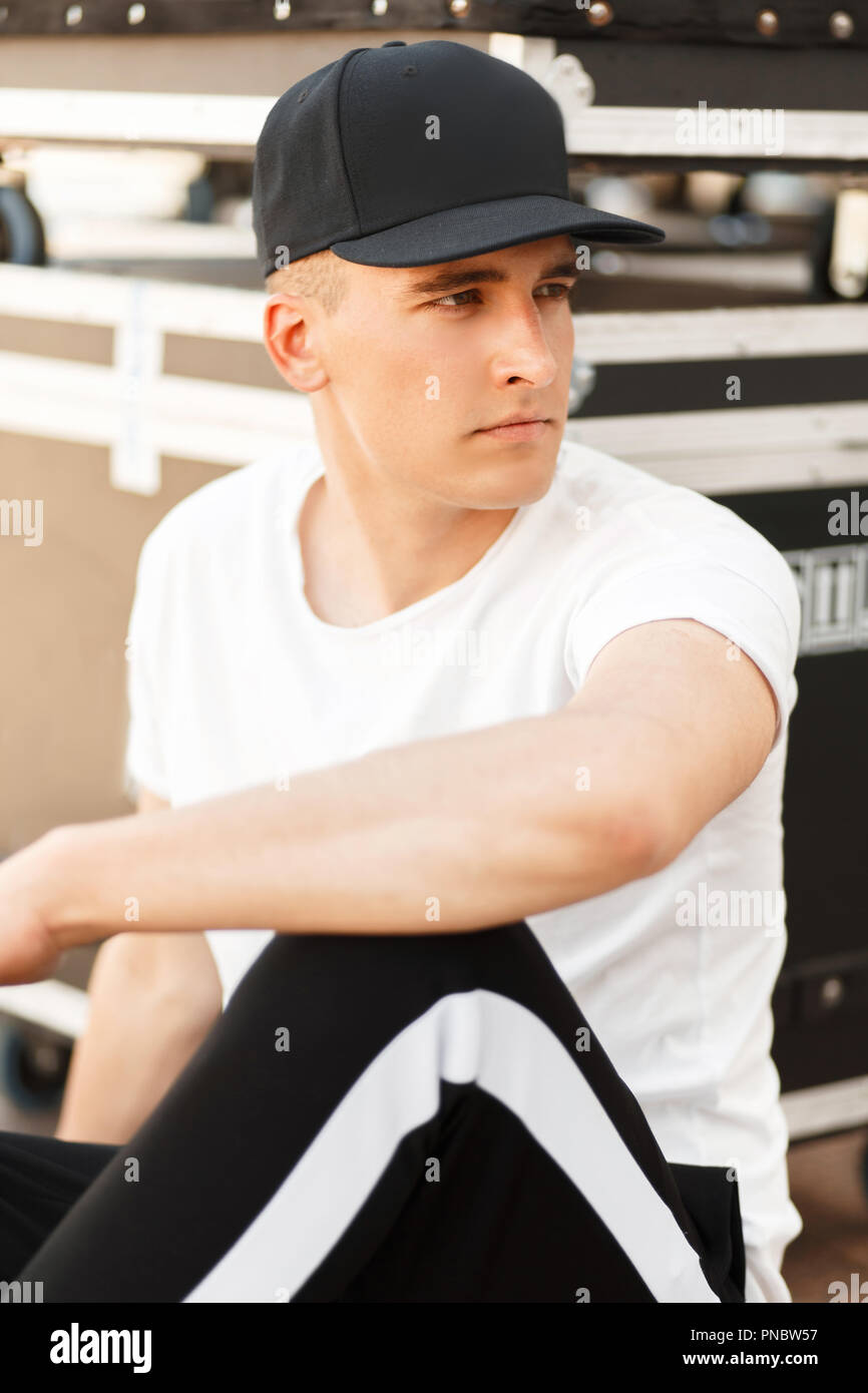 Handsome young model man with a cap in 