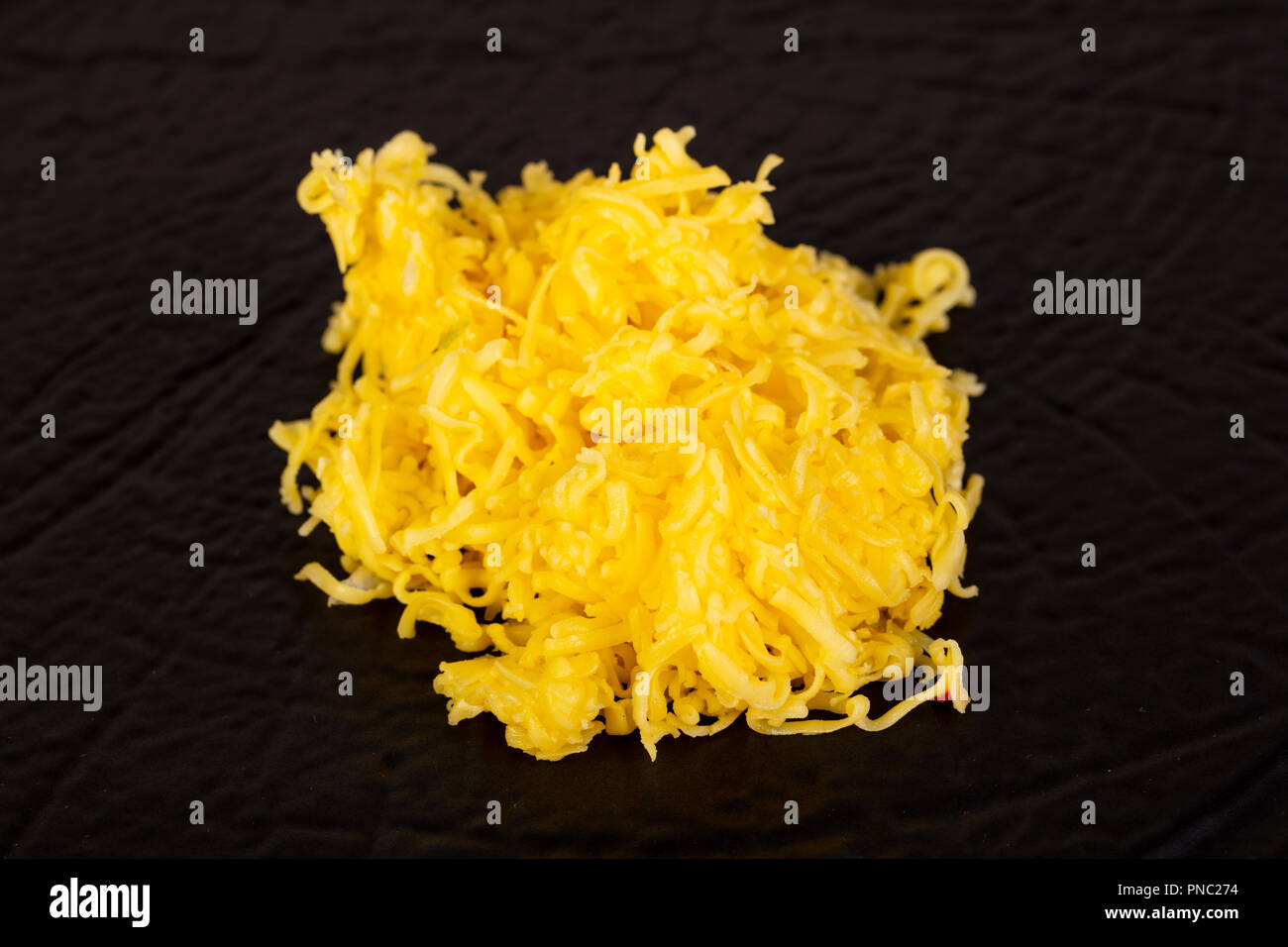 https://c8.alamy.com/comp/PNC274/shredded-yellow-cheese-topping-heap-PNC274.jpg