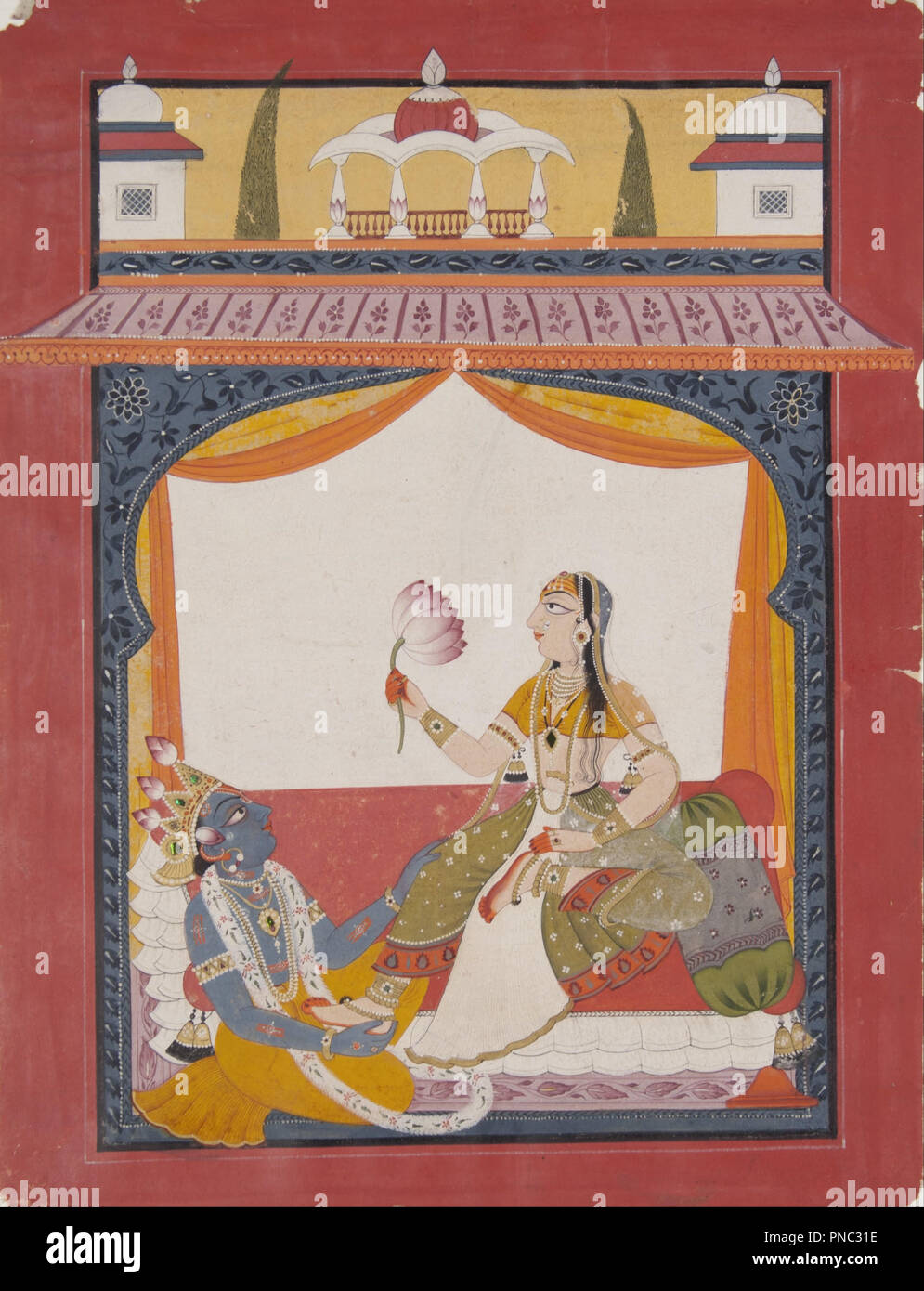 Krishna massaging the feet of Radha, a scene possibly from the Gita Govinda. Date/Period: 1725/1735. Painting. Ink, opaque watercolor, gold, and beetle thorax casings on paper. Width: 20.3 mm. Height: 26.7 mm (work). Author: India, Punjab Hills, Mankot School. Stock Photo