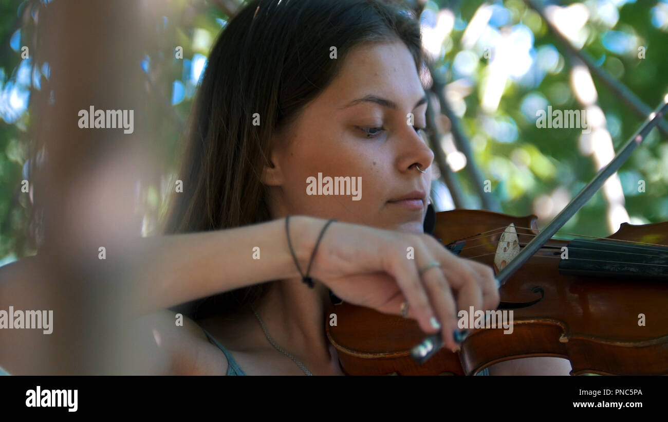 Young girl playing the vintage violin on the nature Stock Photo - Alamy