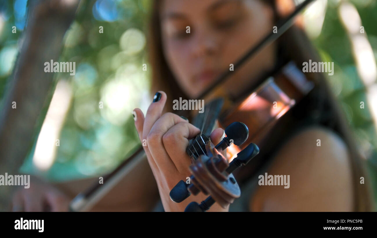 Young girl playing the vintage violin on the nature Stock Photo - Alamy
