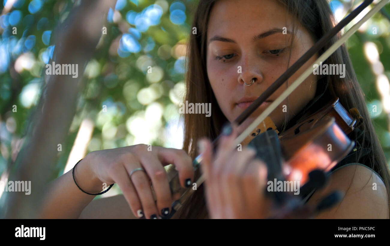 Young girl playing the vintage violin on the nature Stock Photo - Alamy