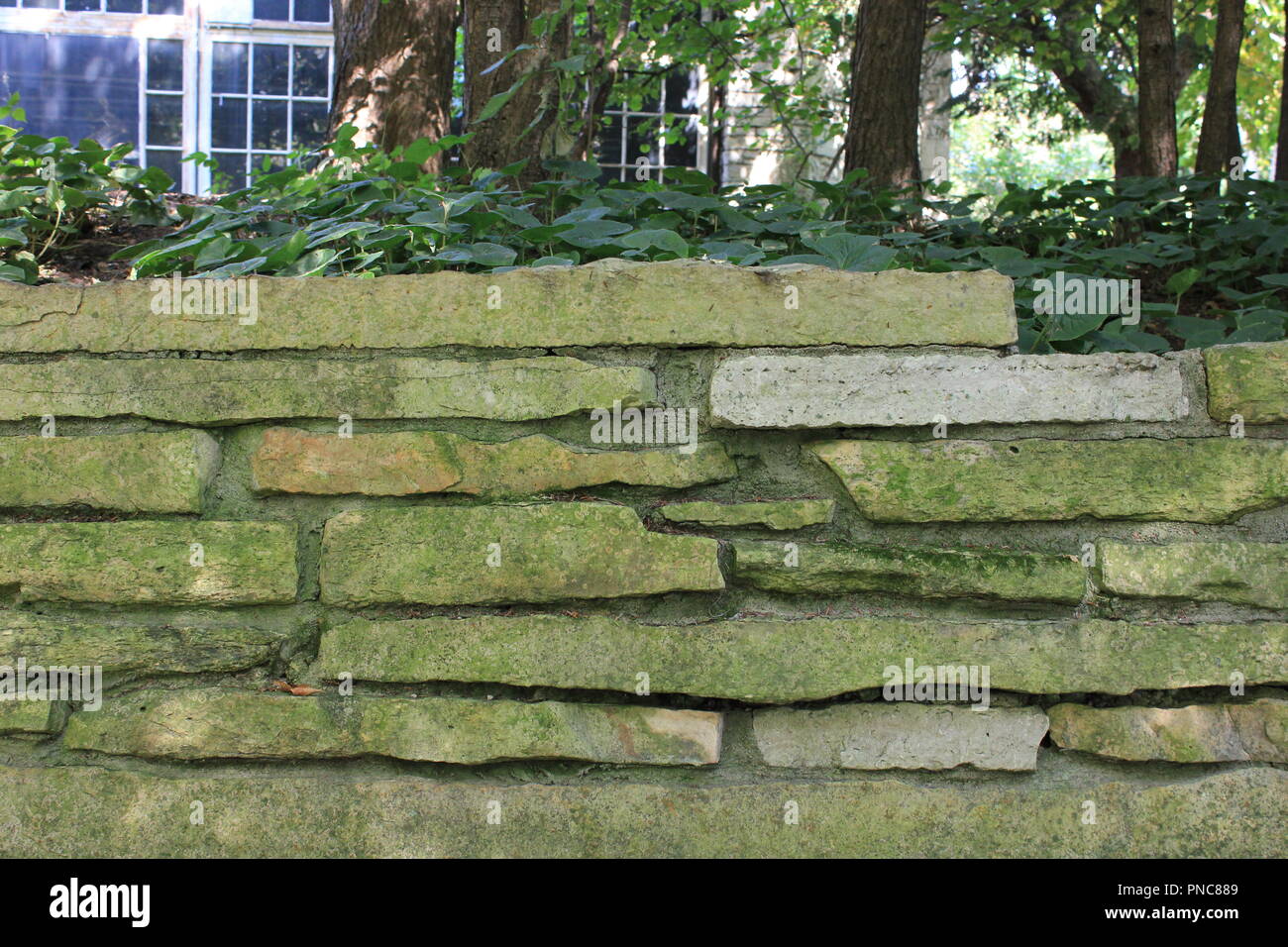 Evanston Historical Society weathered limestone garden wall located on