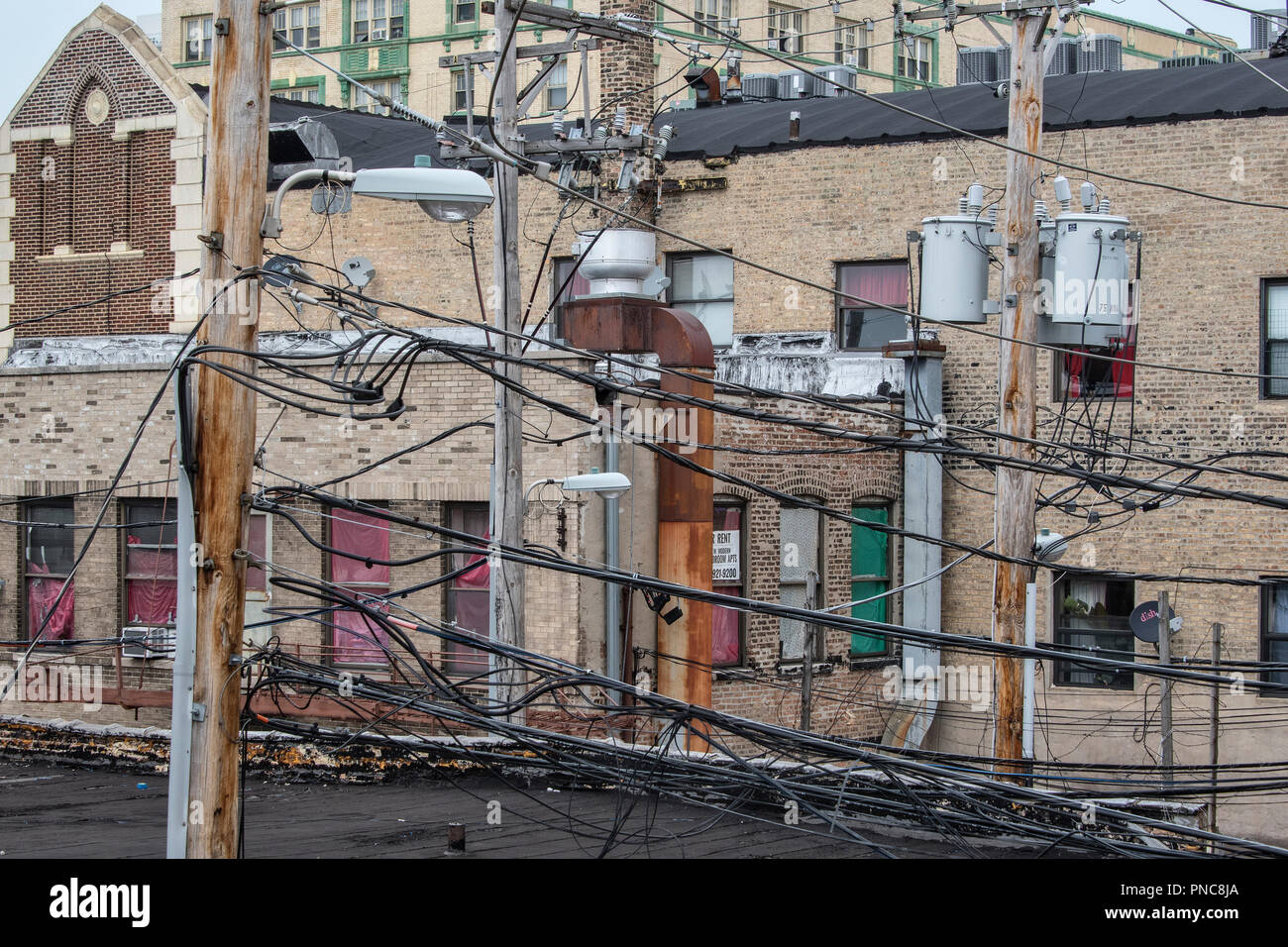 Antiquated power lines and utility poles in Uptown, Chicago, IL. Stock Photo