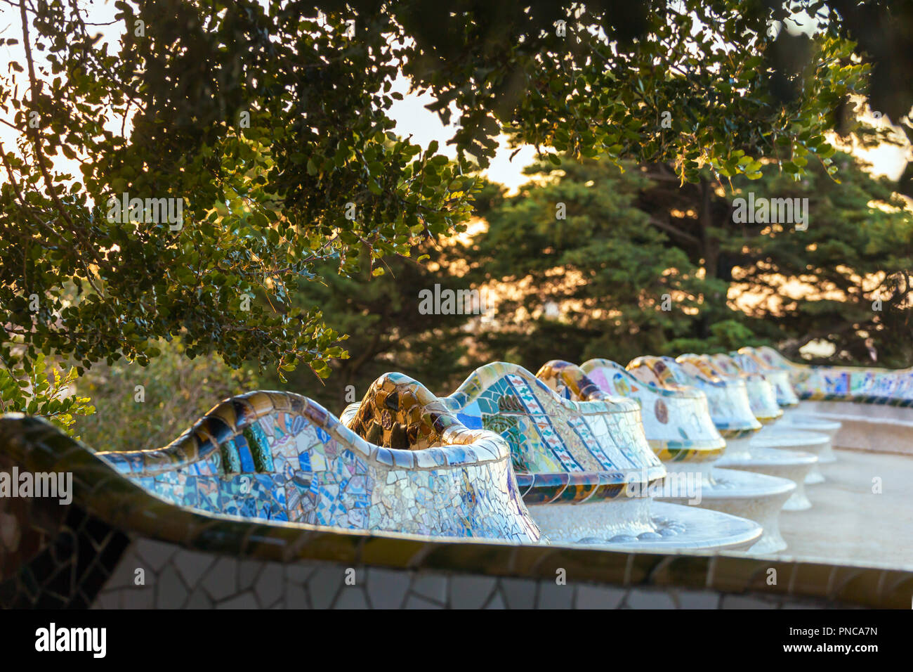 Famous colorful bench in Park Guell designed by Antoni Gaudi in Barcelona, Spain. Stock Photo