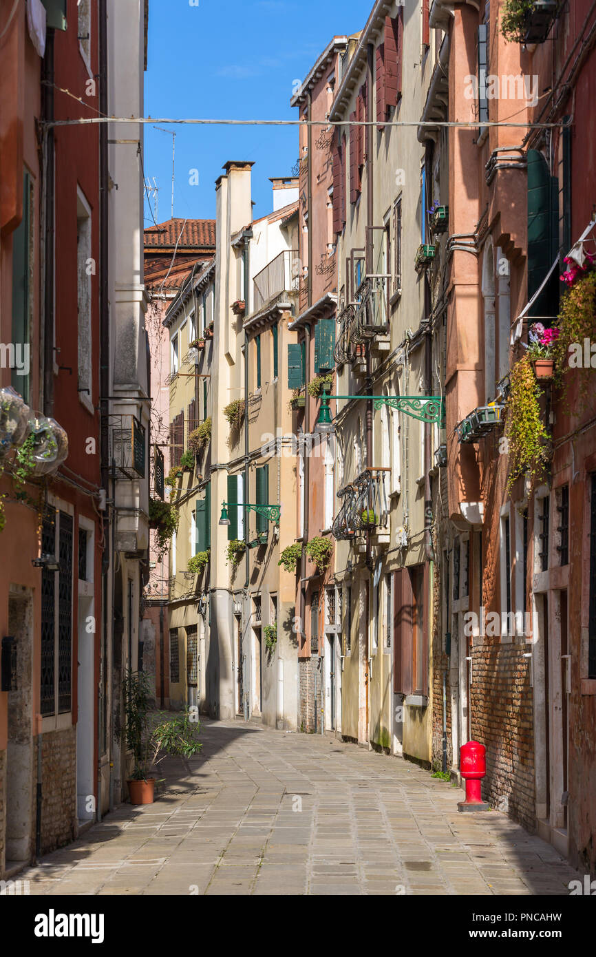 Narrow italian street in Venice, Italy Stock Photo