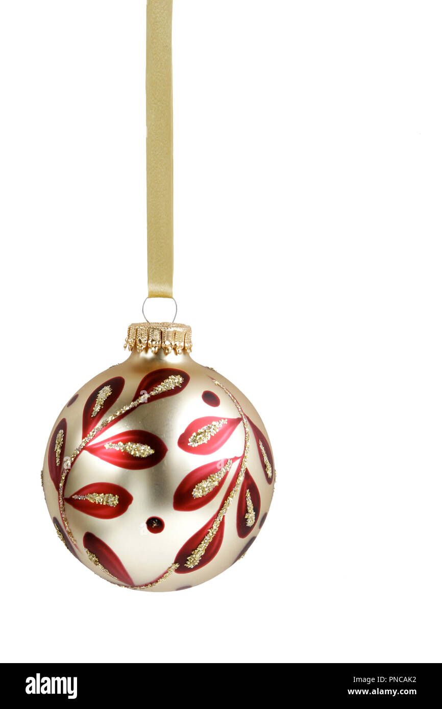 Elegant gold and red Christmas ornament on white background -- vertical presentation Stock Photo