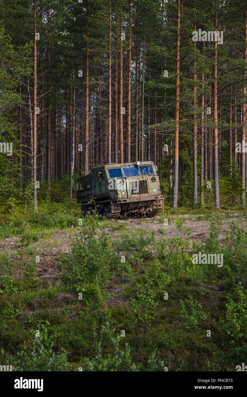 Old soviet artillery tractor by the woods at Suomussalmi in Finland Stock Photo