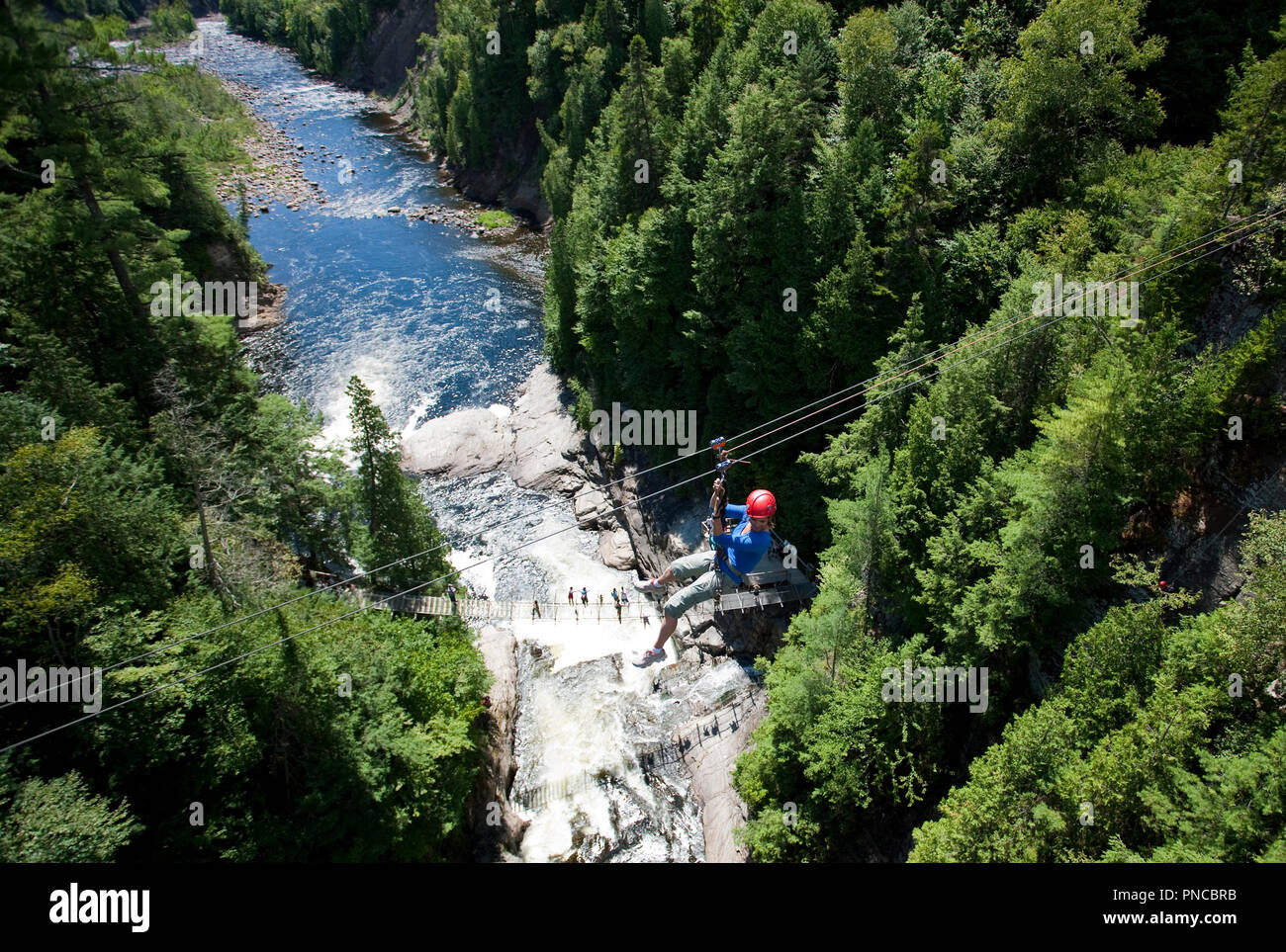 North America, Canada, Quebec, Beaupre, Canyon Ste-Anne, woman on zip line Stock Photo