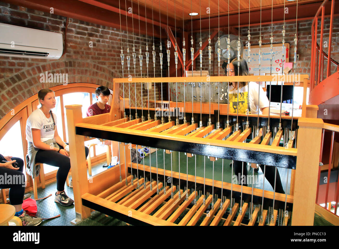 A chimesmaster playing the Cornell Chimes during a chimes concert in McGraw Tower.Cornell University. Ithaca.New York.USA Stock Photo