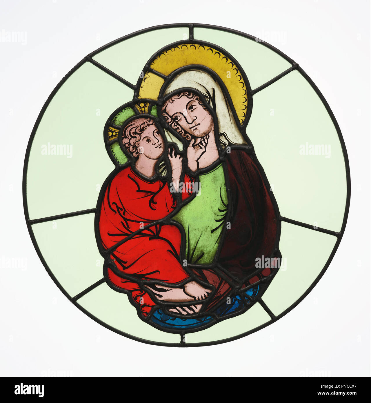 The Virgin and Child. Date/Period: Ca. 1335. Stained Glass. Pot-metal and colorless glass, oxide paint, and silver stain; lead came. Height: 359 mm (14.13 in); Width: 203 mm (7.99 in). Author: Master of Klosterneuburg. Stock Photo