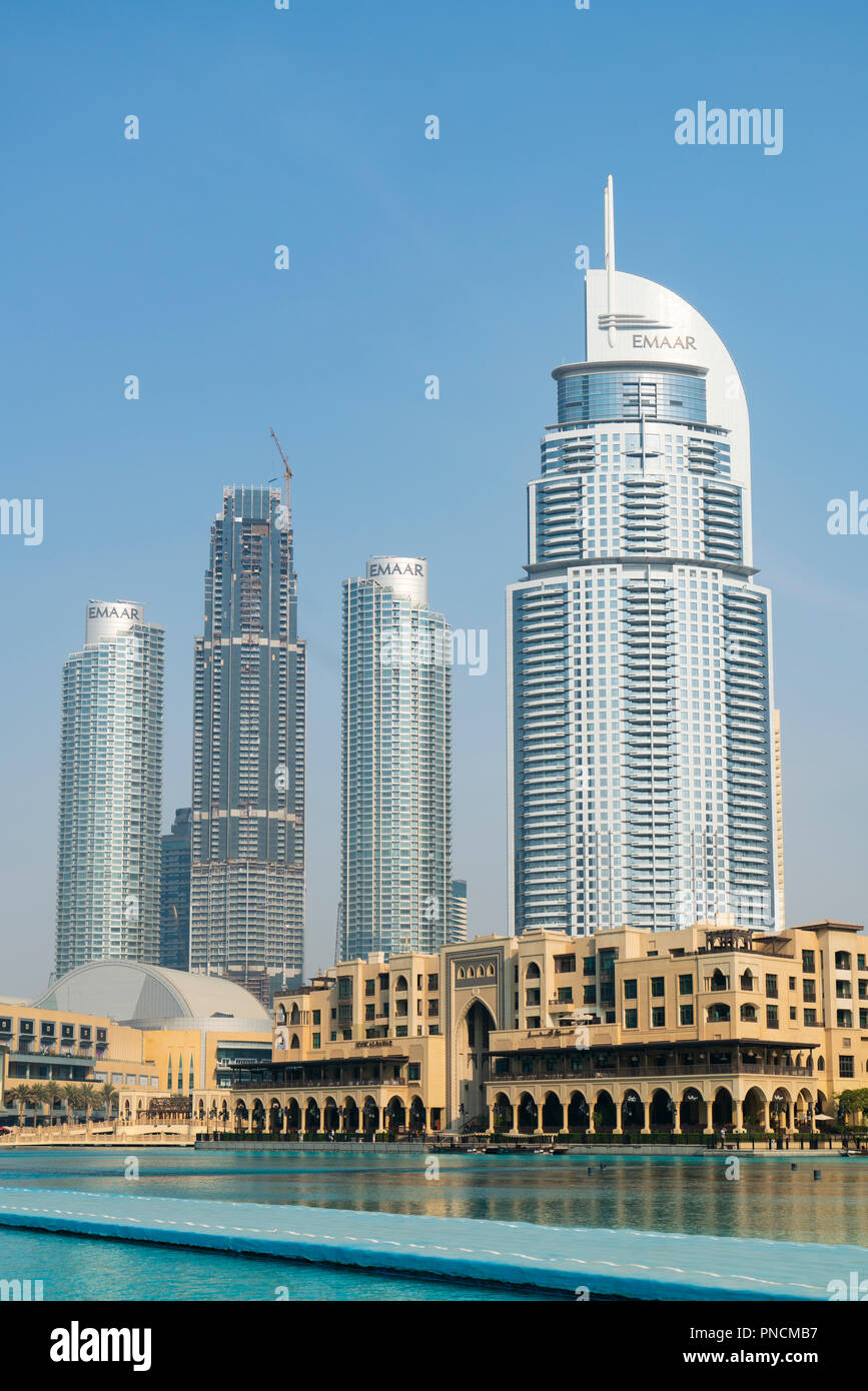 Exterior of the Dubai Mall with new high rise apartment towers under construction to rear in Dubai, United Arab Emirates. Stock Photo