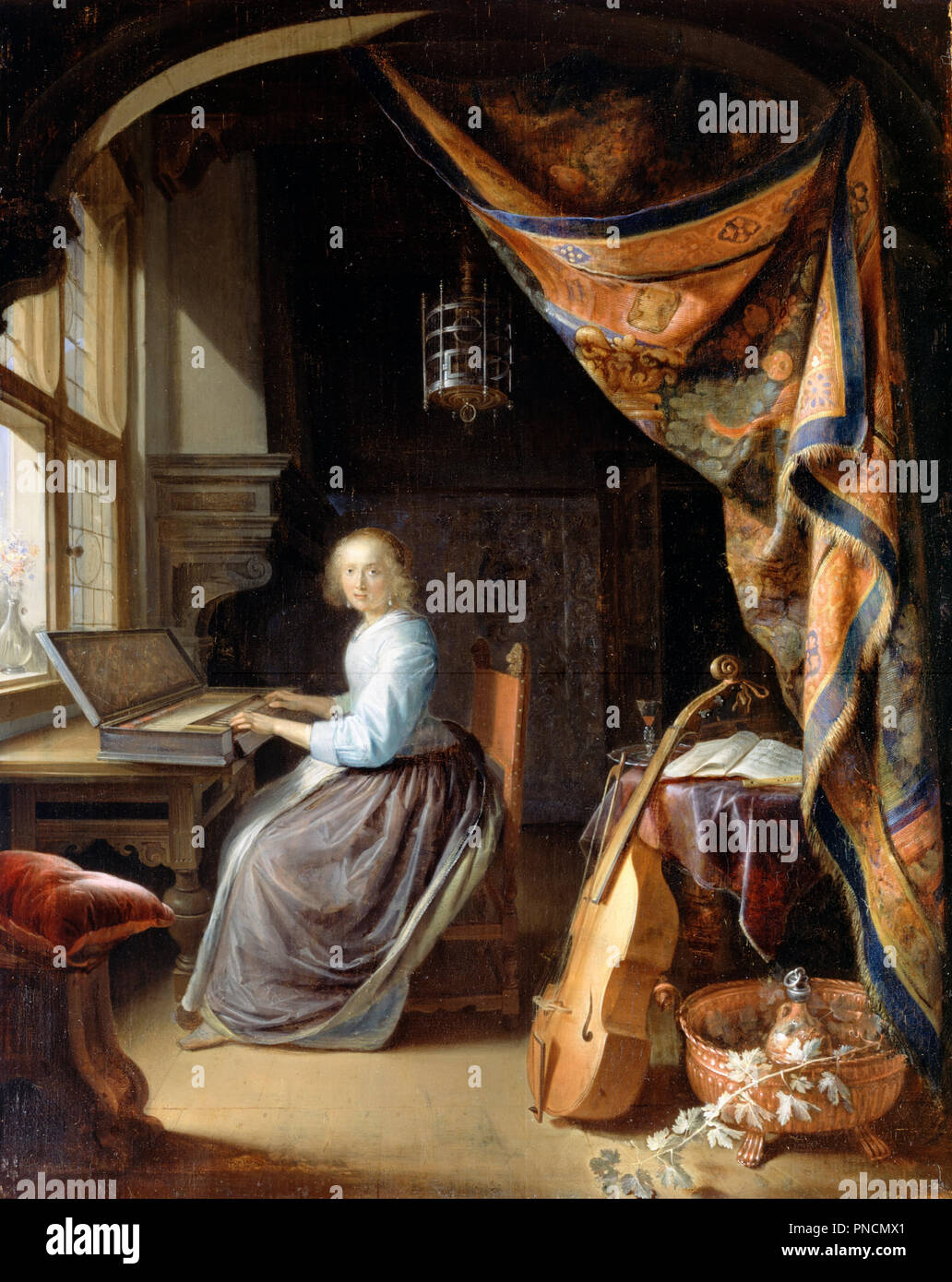 A Woman playing a Clavichord. Date/Period: Ca. 1665. Painting. Oil on panel Oil. Height: 377 mm (14.84 in); Width: 299 mm (11.77 in). Author: DOU, GERRIT. Gerard Dou. Stock Photo
