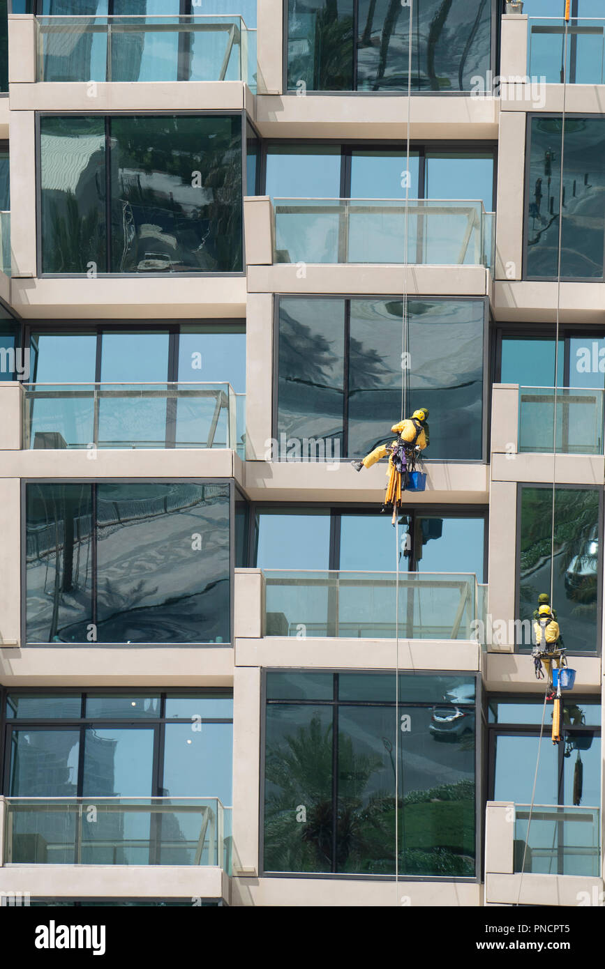Detail of windows and balconies and window cleaners on new high rise apartment building in Downtown Dubai, UAE, United Arab Emirates. Stock Photo