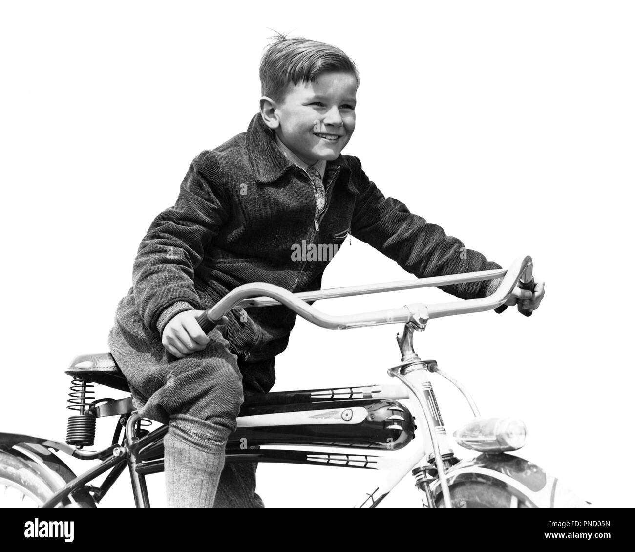 1930s SMILING BOY IN AUTUMN CORDUROY JACKET KNEE SOCKS AND PANTS  PEDALING HEAVY AMERICAN SPACE SHIP DESIGN STYLE BICYCLE  - b394 HAR001 HARS LIFESTYLE SPEED SATISFACTION BIKING RURAL HEALTHINESS COPY SPACE HALF-LENGTH PHYSICAL FITNESS HEAVY MALES RISK BICYCLES TRANSPORTATION EXPRESSIONS B&W BIKES FREEDOM SUCCESS DREAMS HAPPINESS CHEERFUL HEADLIGHT ADVENTURE DISCOVERY STRENGTH AND CORDUROY EXCITEMENT RECREATION PRIDE SMILES KNEE SOCKS IMAGINATION JOYFUL PEDDLING STYLISH JUVENILES PEDALING PRE-TEEN PRE-TEEN BOY BLACK AND WHITE CAUCASIAN ETHNICITY HAR001 OLD FASHIONED Stock Photo