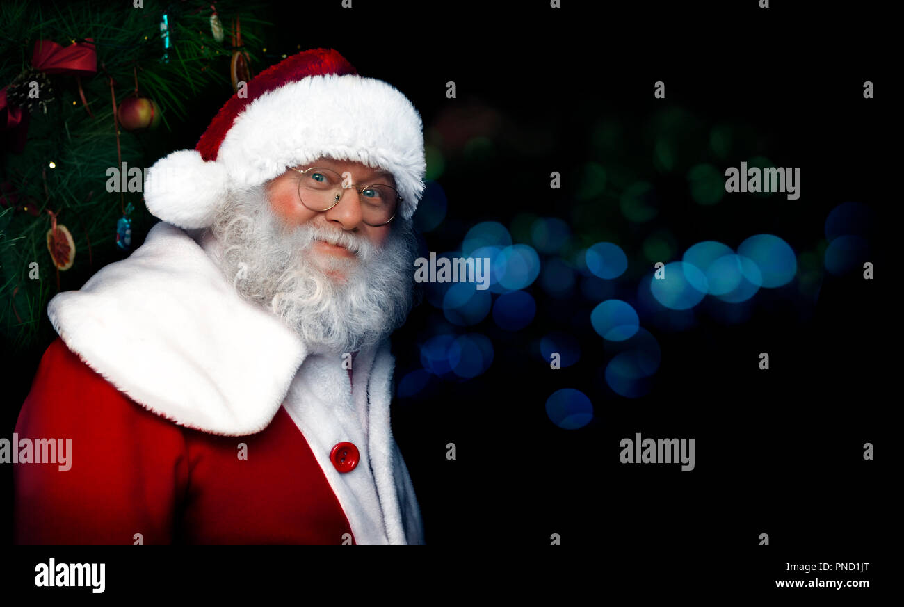 Santa Claus on Christmas concept. Close-up portrait of a fairytale Santa Claus. Good old traditions. Family holidays. Stock Photo