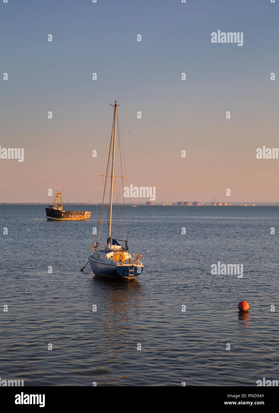 Small boats during golden hour at Leigh On Sea, Essex Stock Photo - Alamy