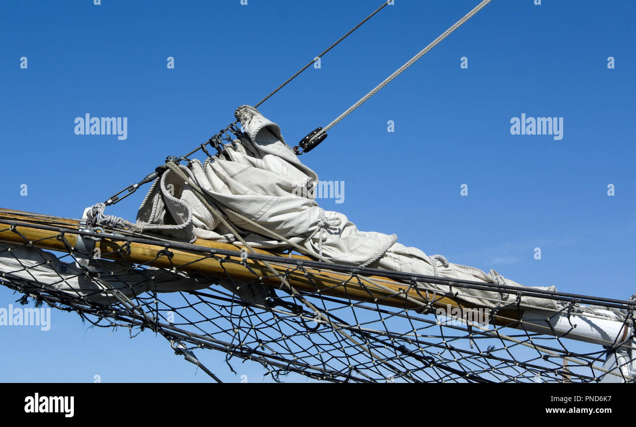 Furled jib sail on bowsprit of S/V Denis Sullivan, Milwaukee, WI Discovery World schooner Stock Photo