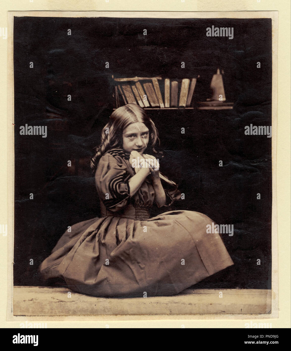 Girl with dove. Date/Period: 1860/1870. Albumen print. Width: 12.2 cm. Height: 14 cm (Image). Author: Oscar Rejlander. Stock Photo