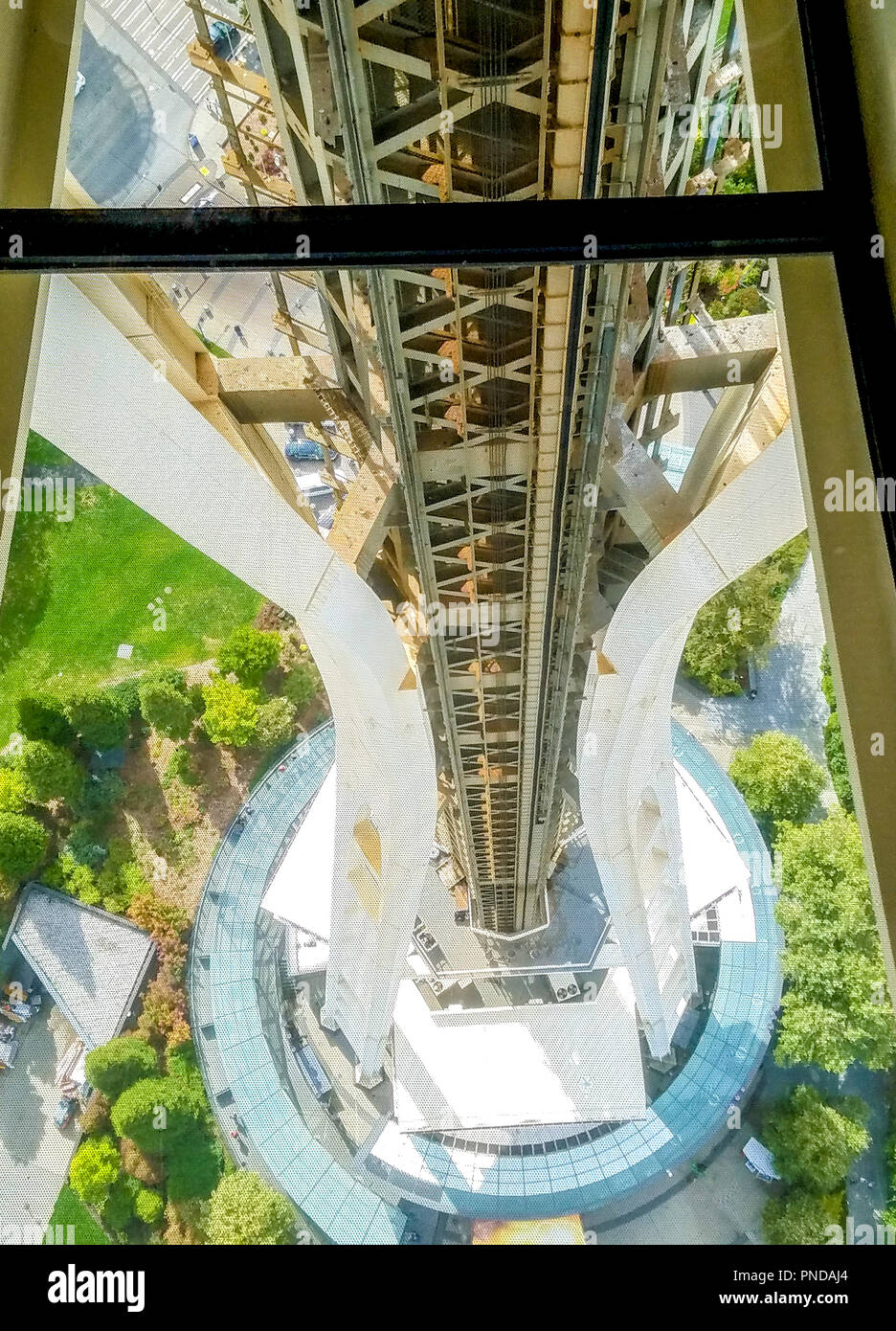 View of the elevator tower of the Seattle Space Needle from the rotating glass floor. This view was not possible before the renovation. Stock Photo