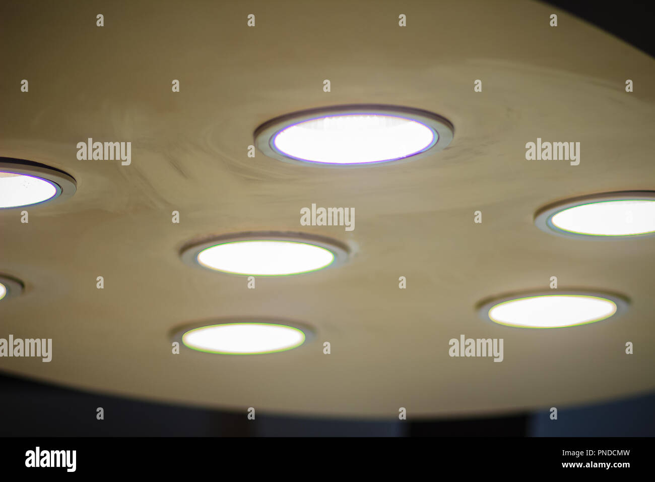 Surgical lamp at an abandoned hospital. Bright light from the operating lamp with the old ceiling. Stock Photo