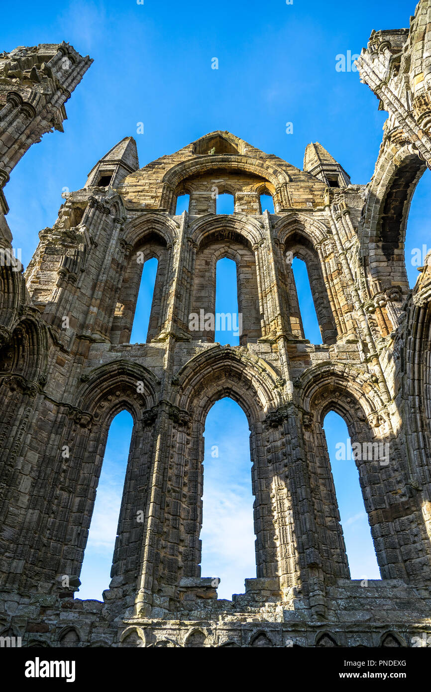Whitby Abbey North Yorkshire Coast UK. Perched high on a cliff, the haunting remains of Whitby Abbey were inspiration for Bram Stoker's gothic tale of Stock Photo