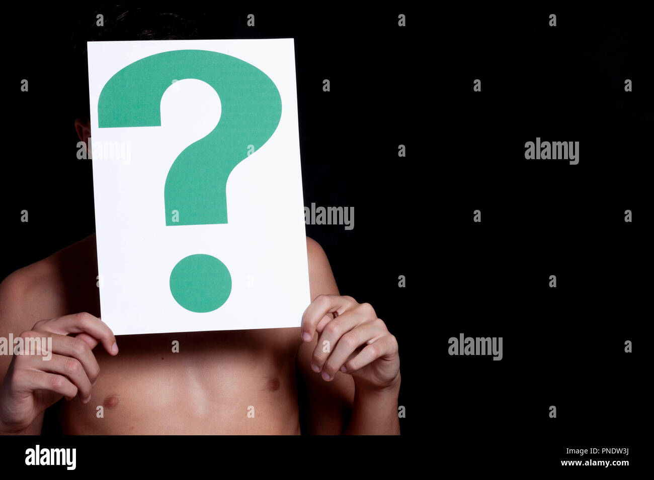 boy holding a question mark Stock Photo