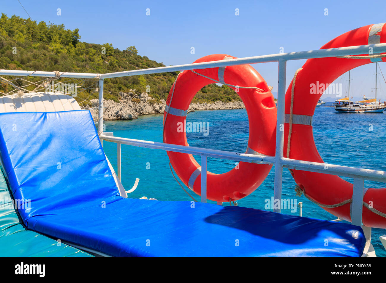 Safety rings on boat in Green sea bay in Marmaris, Turkey Stock Photo