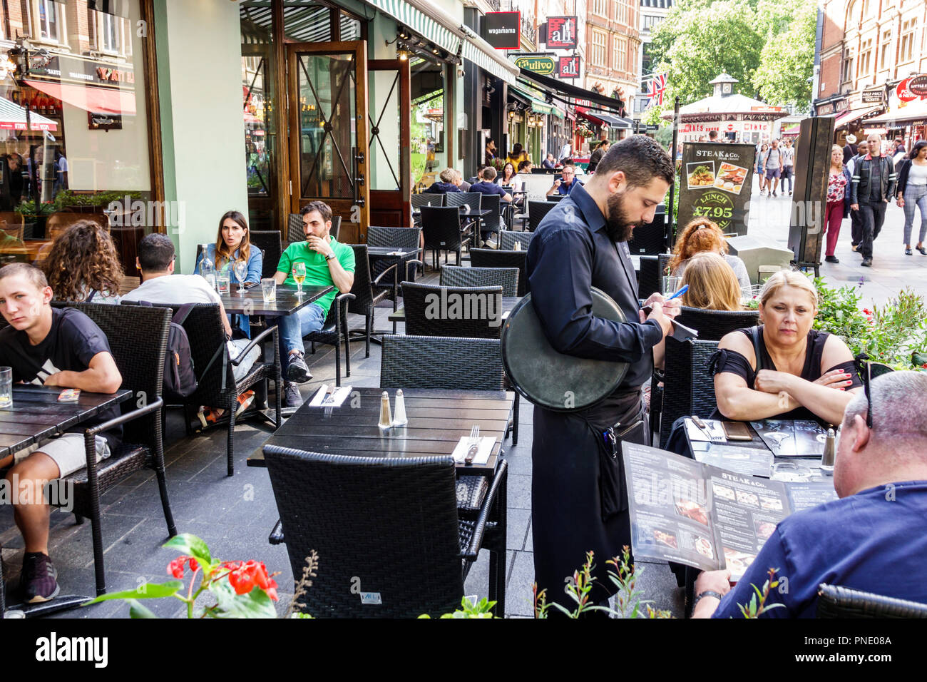 London England,UK Leicester Square,Steak & Co.,restaurant restaurants food dining cafe cafes,al fresco,sidewalk outside tables dining street cafe,dini Stock Photo