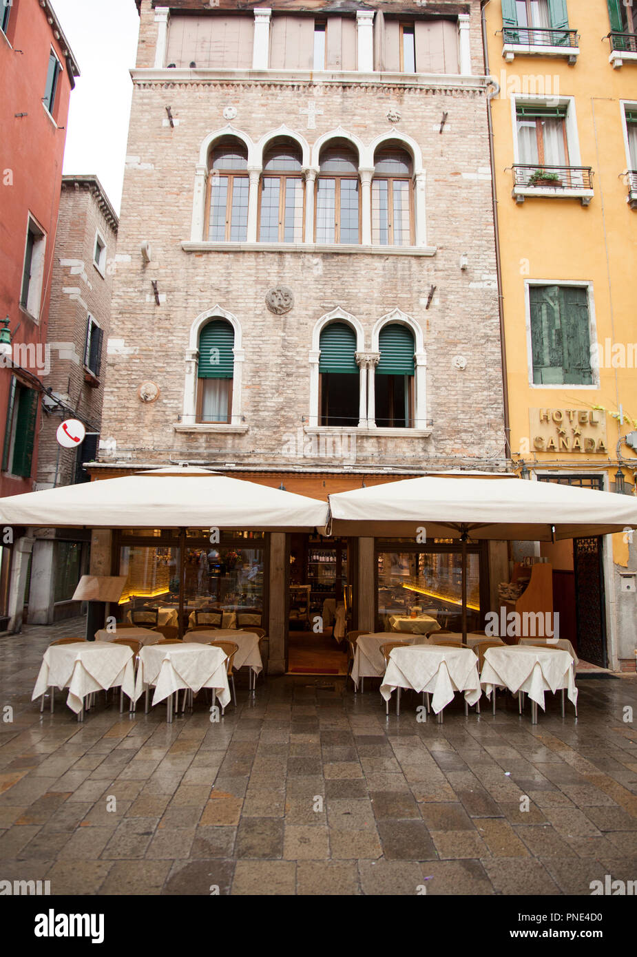 outside restaurant patios are common throughout Venice, Italy Stock