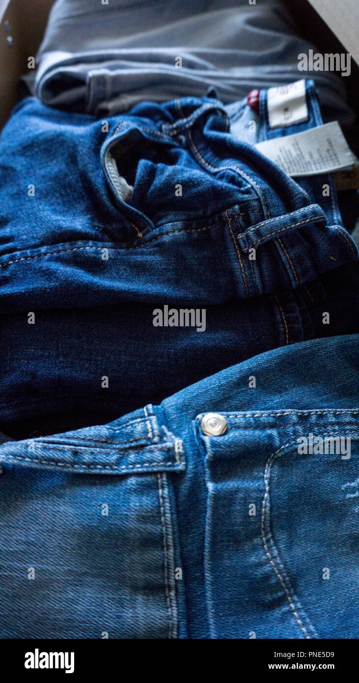 Denim trousers pants drawer folded Stock Photo Alamy