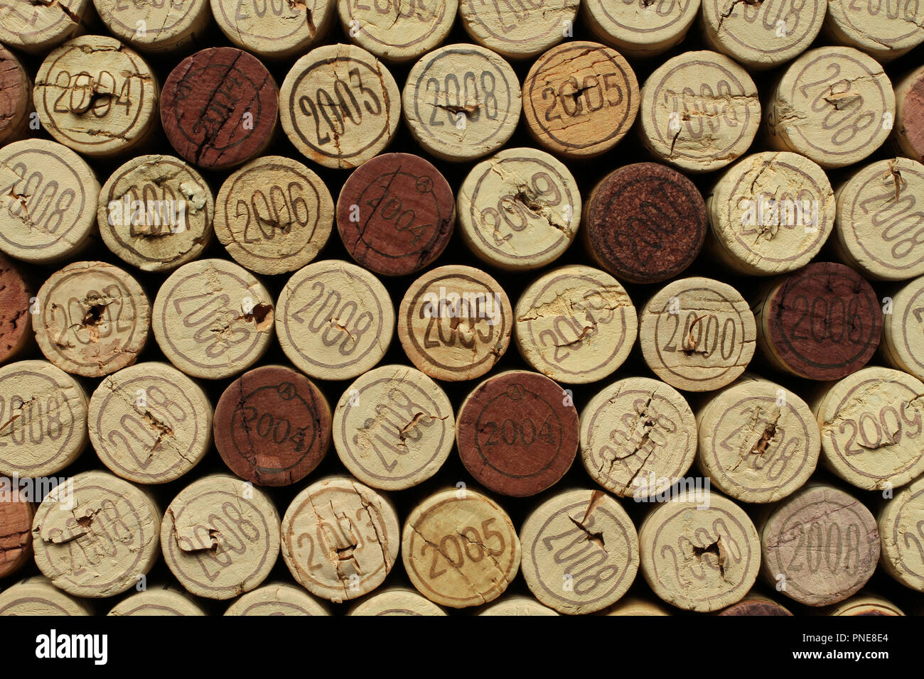Wine bottle cork tops with numbers of years densely arranged to each