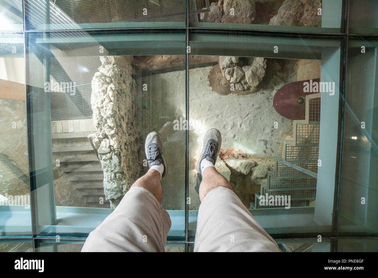 Cartagena, Spain September 14th, 2018 Visitor over the glass floor of Punic Wall