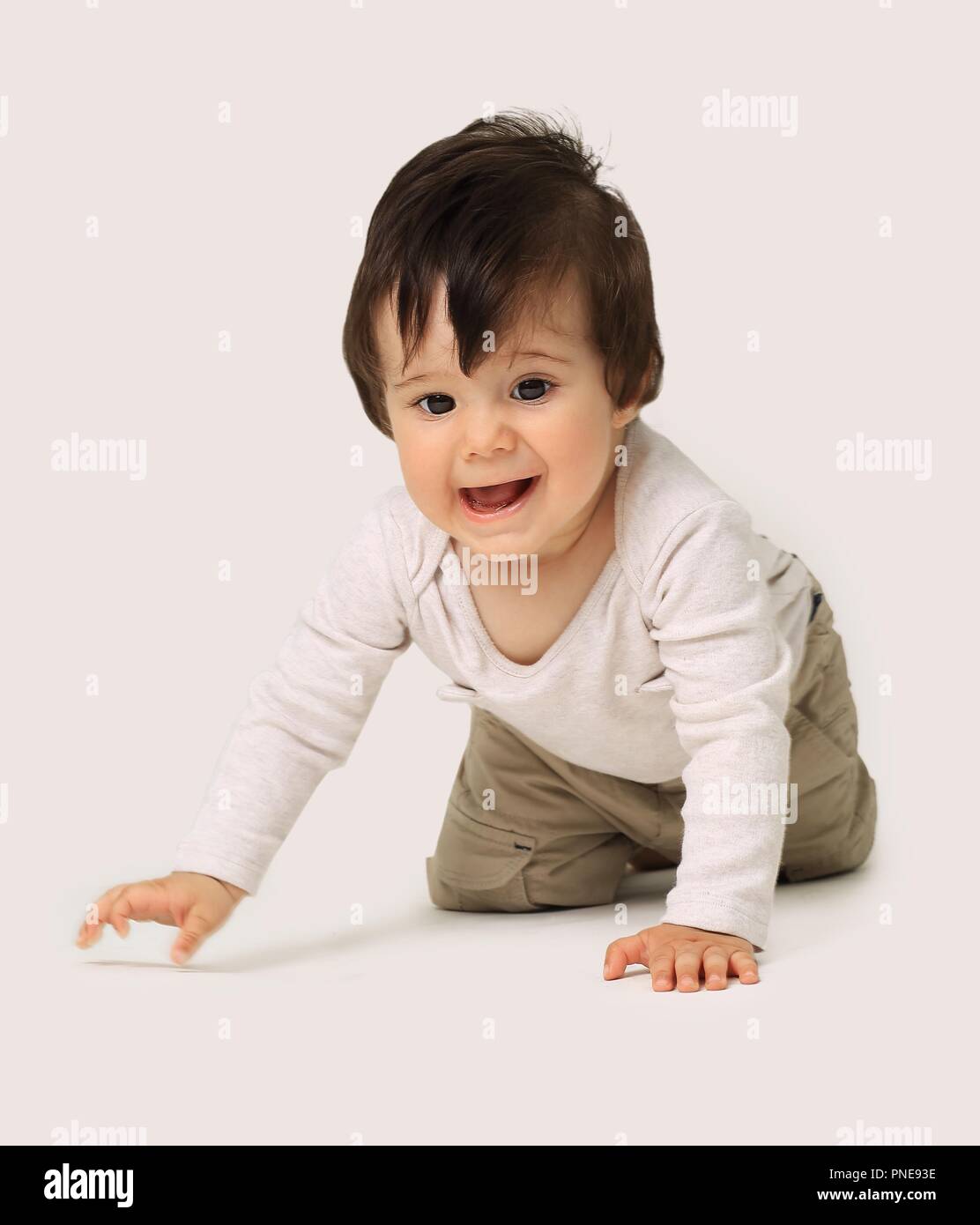the baby learns to crawl isolated on white background Stock Photo - Alamy
